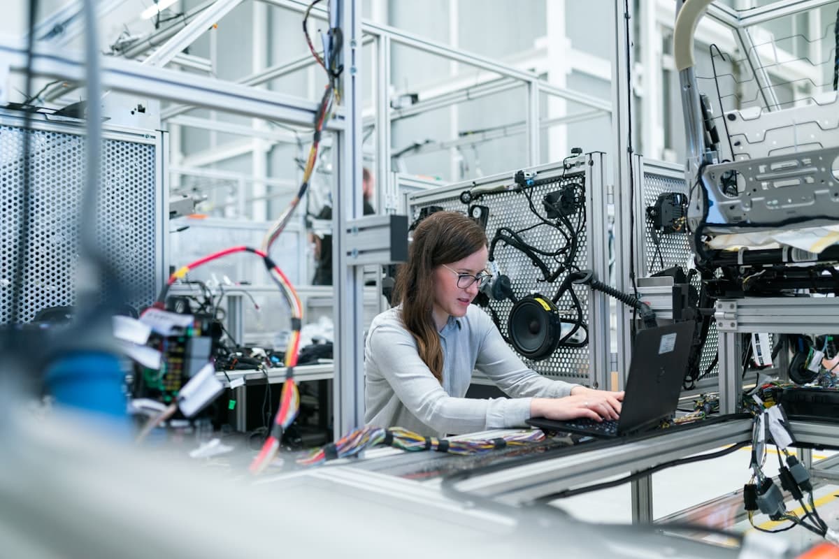 Engineer working with technology on a modern factory floor